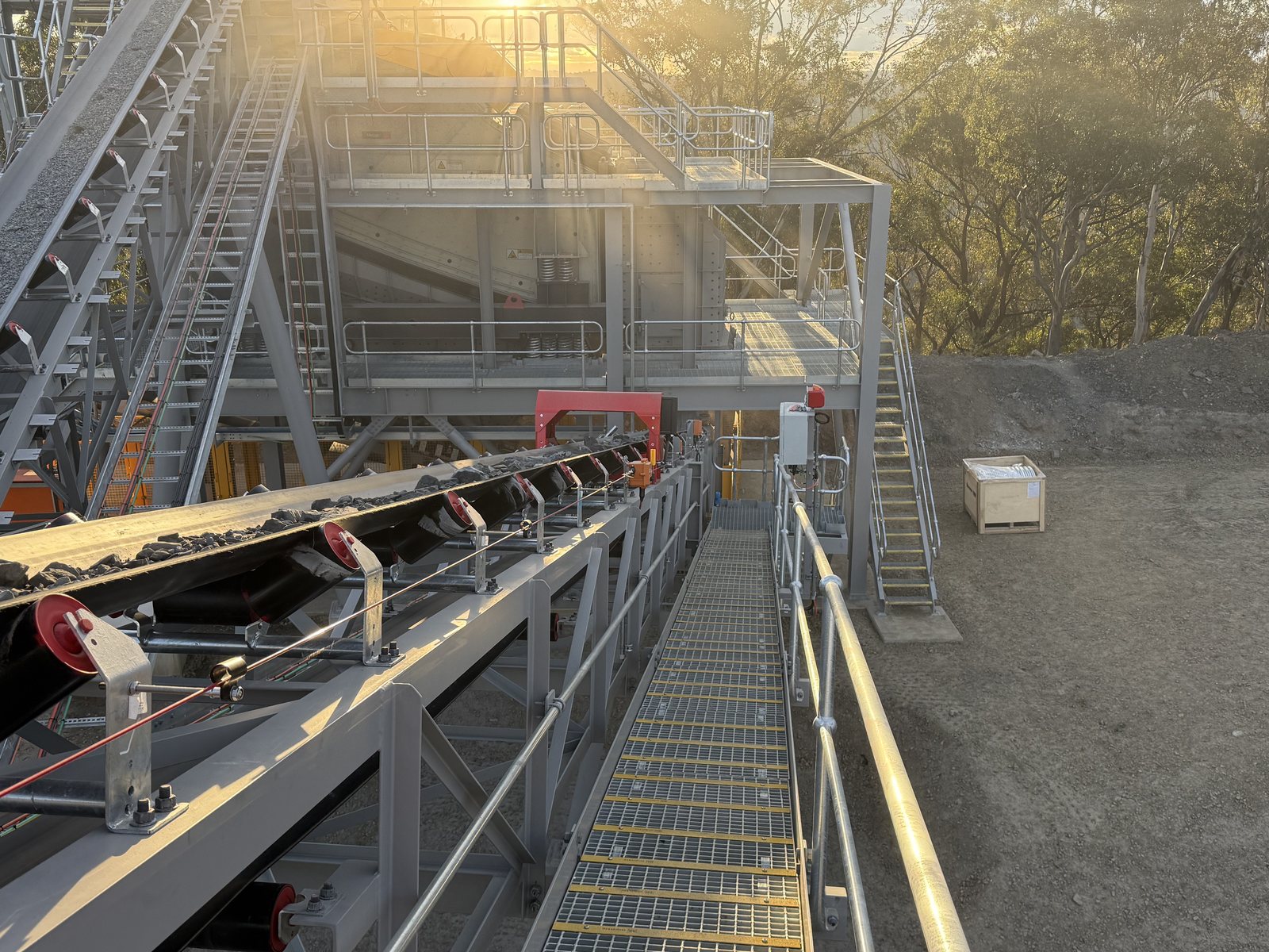 Tramp metal detector installed below the screen house on a quarry conveyor